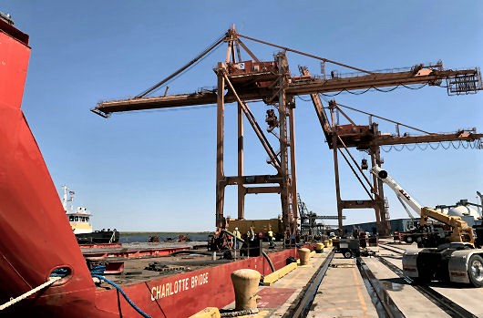 First crane loaded onto barge Charlotte Bridge