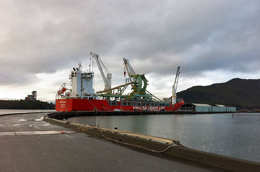 Barge loaded with cranes departs from Newark