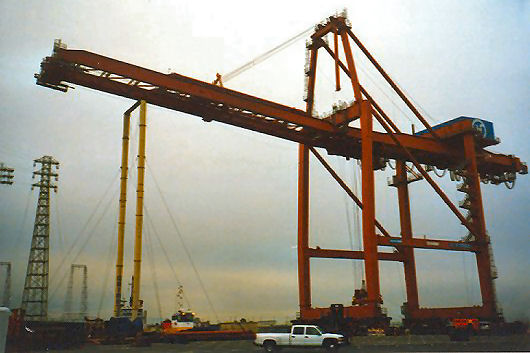 Crane on barge with boom support