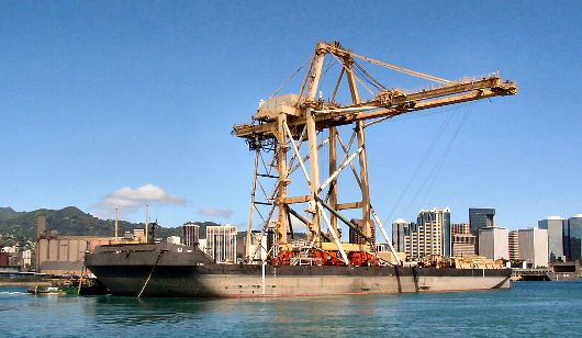 Barge with crane departs Honolulu