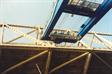 Crane boom clears bridge